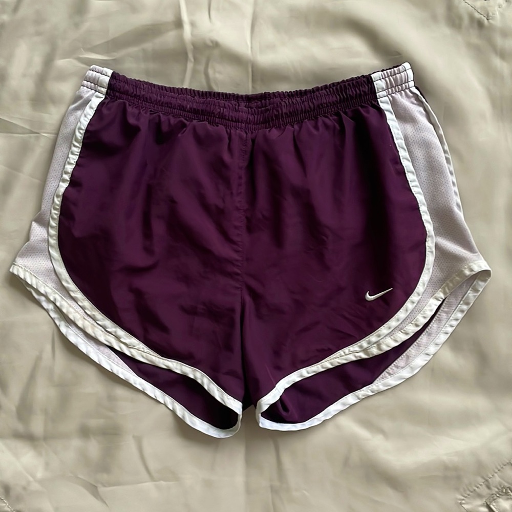 Plumb colored Nike shorts.